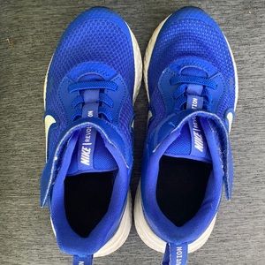 Bright blue kids Nike revolution gym shoes. Size 12c.